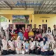 Mahasiswa KKL-PPM Unmal bersama bidan desa, kader kesehatan, dan warga Pekon Kesugihan usai penyuluhan pencegahan stunting di Balai Pekon Kesugihan, Tanggamus, Kamis (14/8/2025). (Foto: Fathur Rizky/Kelampung)